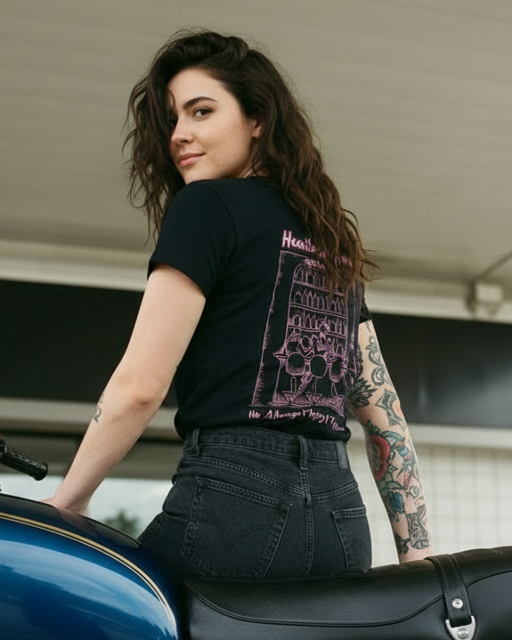 Woman with tattoos sitting on a blue Honda motorcycle