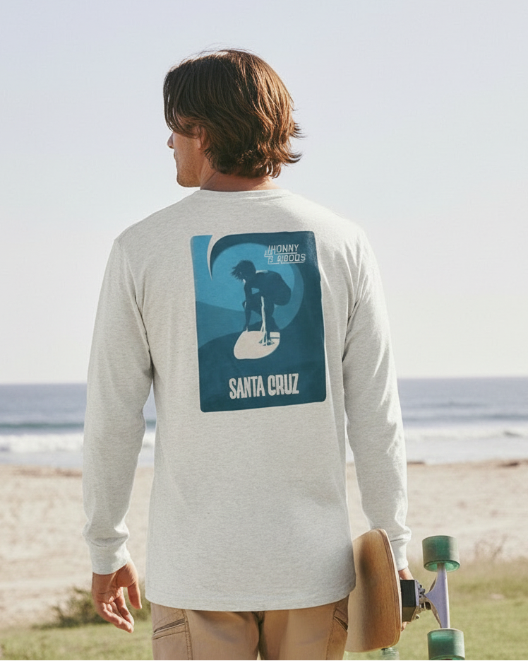 Man wearing a long-sleeve shirt with a graphic design on the beach