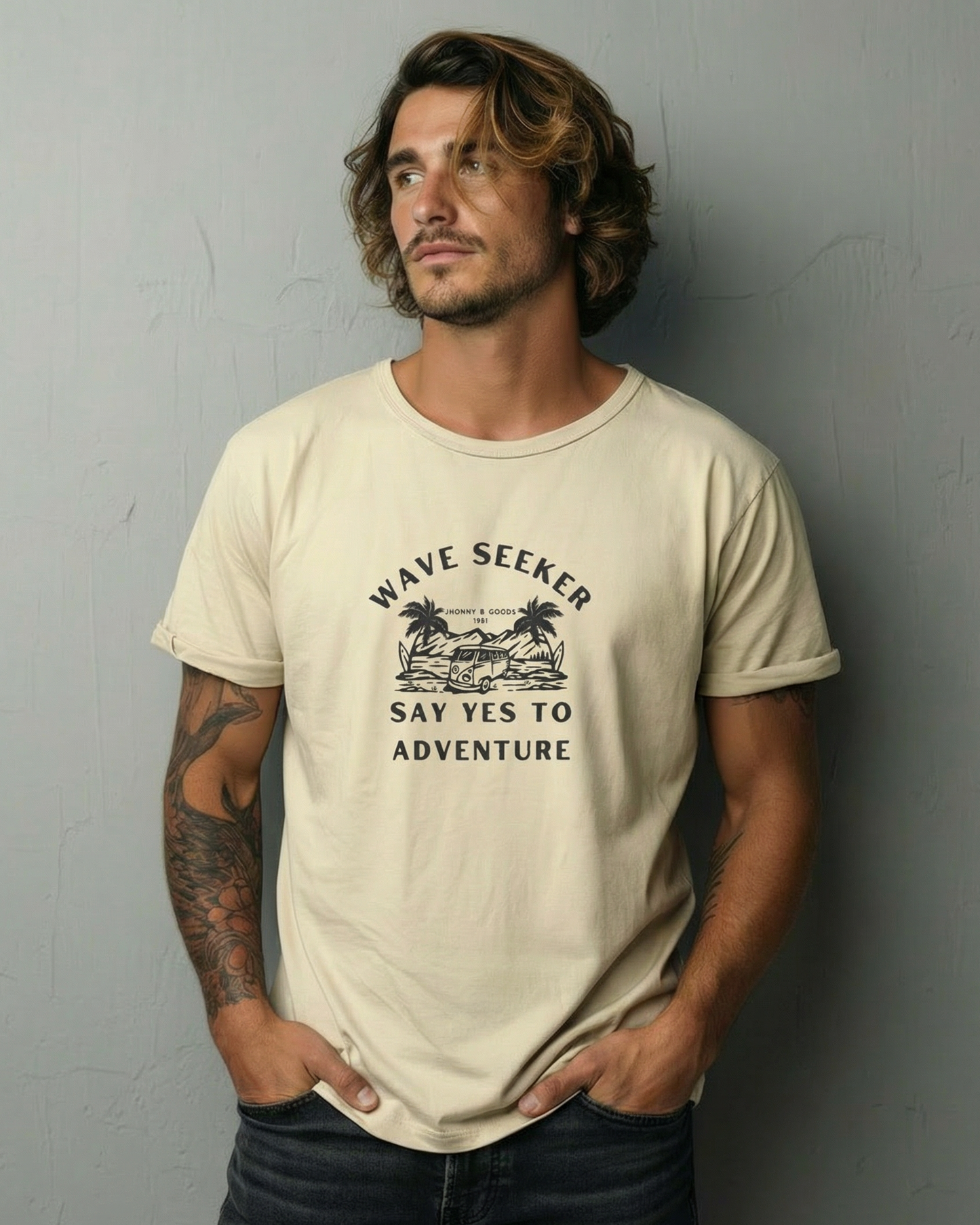 Man wearing a beige t-shirt with text and graphics against a gray background