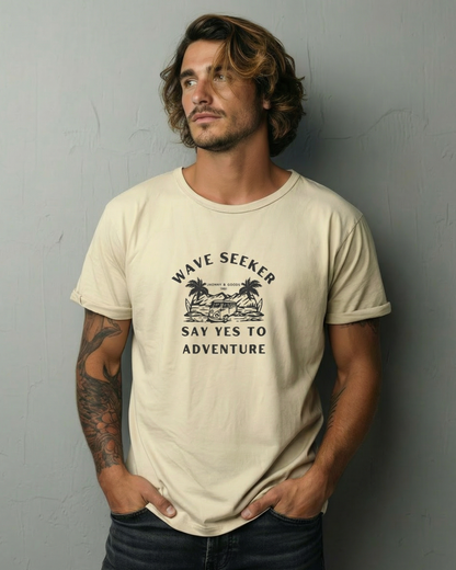 Man wearing a beige t-shirt with text and graphics against a gray background