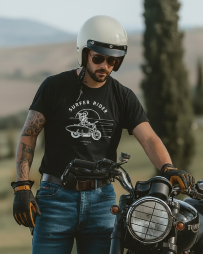 Man standing next to a motorcycle wearing a black t-shirt with 'Surfer Rider' graphic, white helmet, and sunglasses.