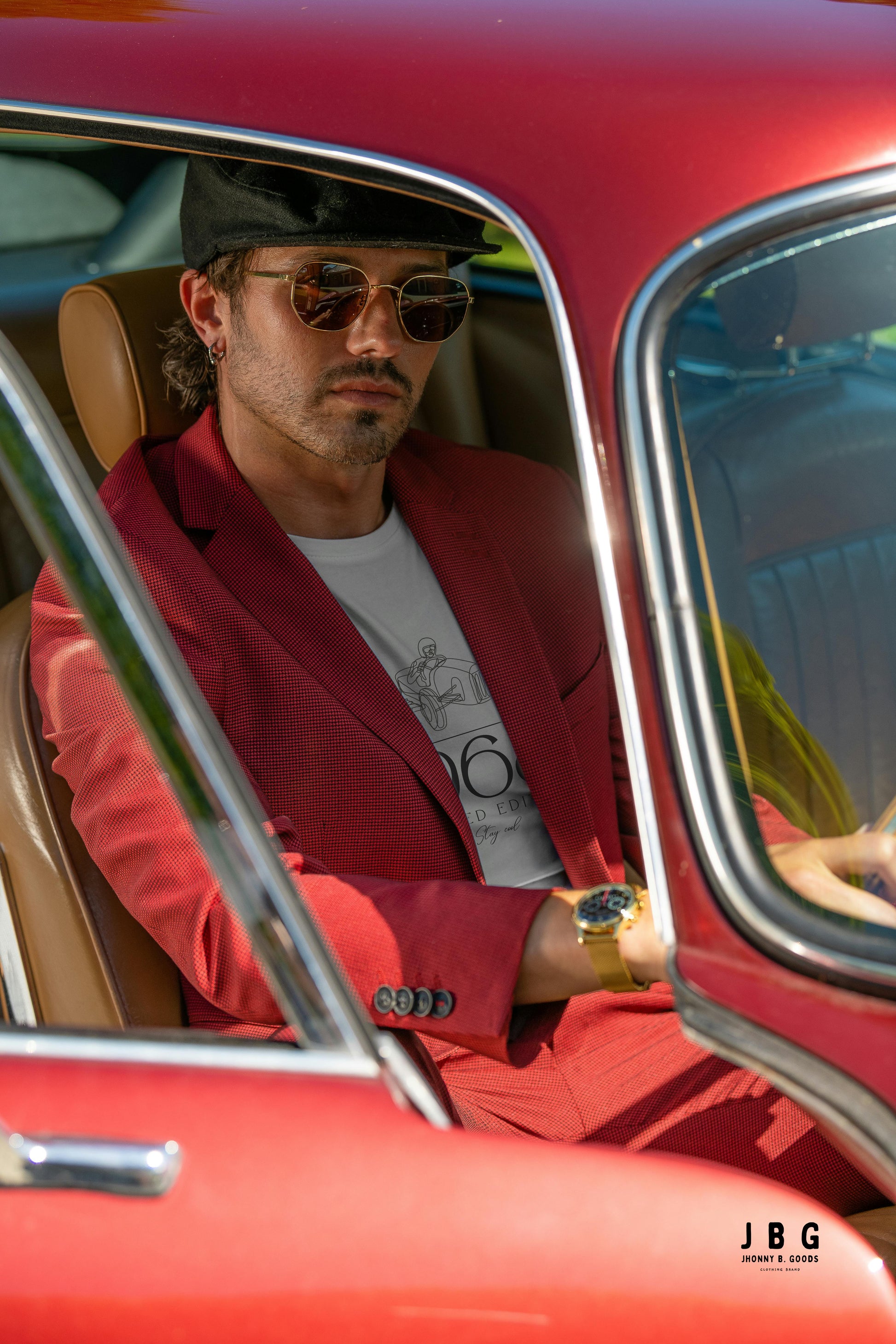 man wearing white tee in vintage car