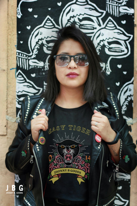 woman wearing black jbg motor tee featuring tiger graphics bold colors 