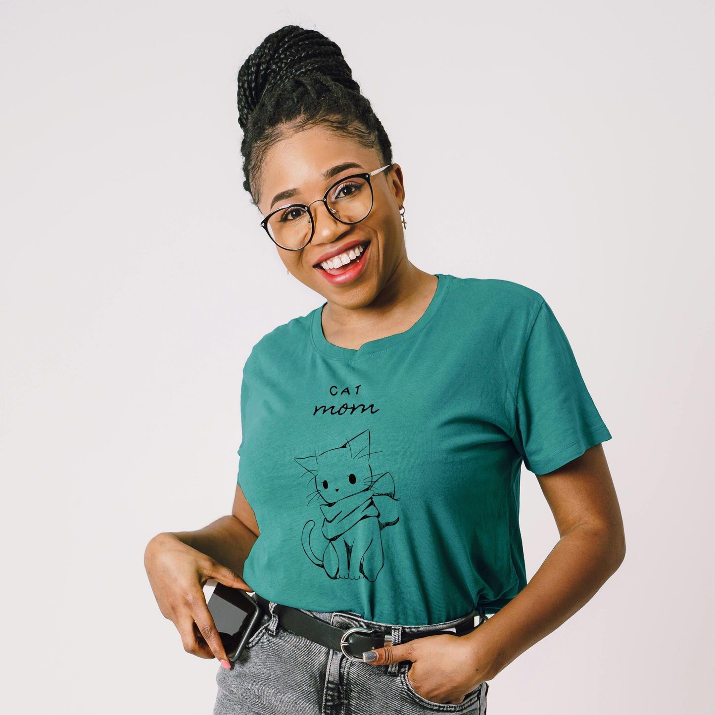 dark woman wearing green turquoise cat tee 