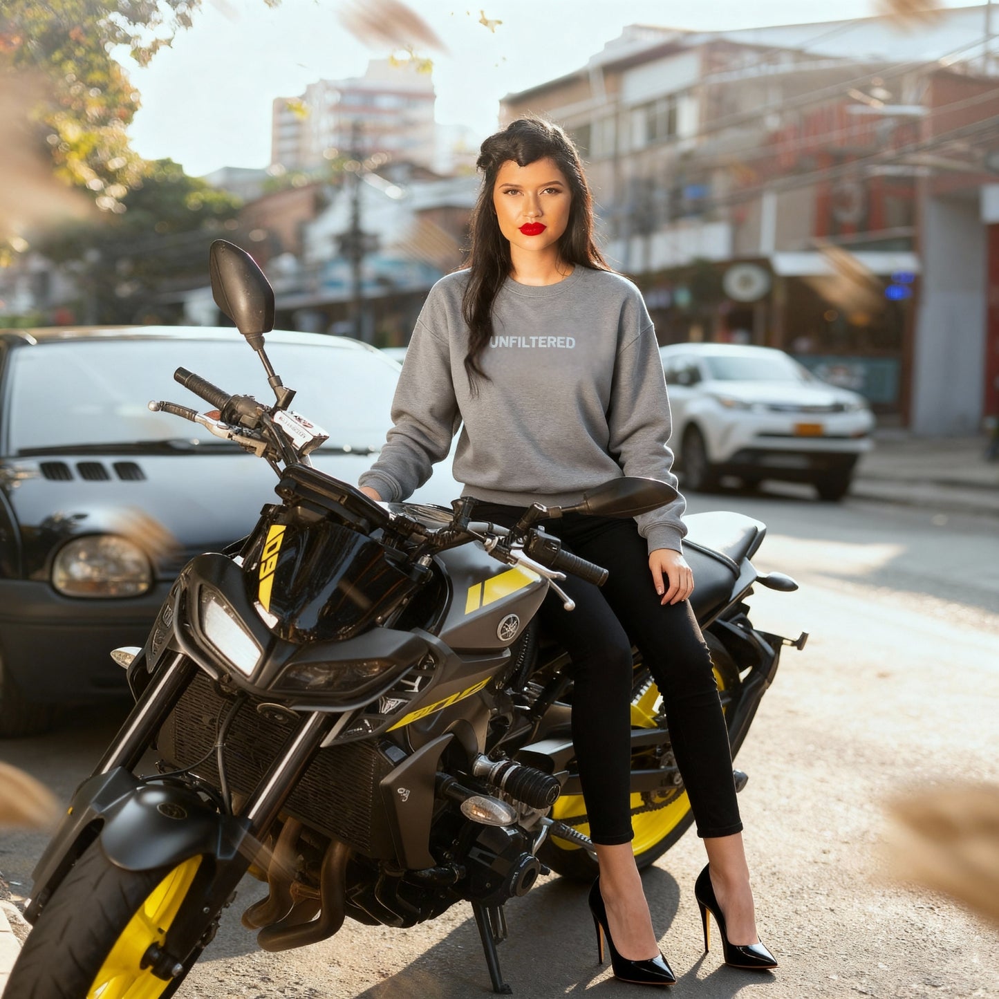 Woman sitting on a motorcycle in an urban setting