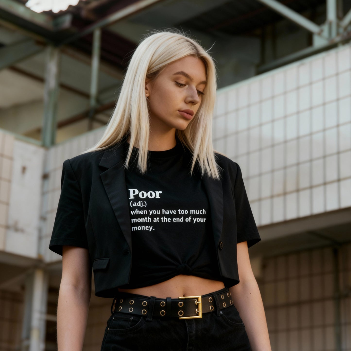 Woman wearing a black t-shirt with text in an urban setting