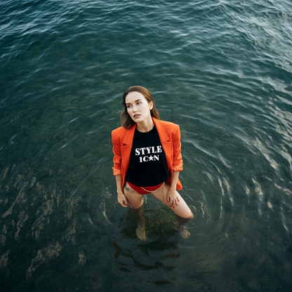 Woman standing in water wearing an orange blazer and JBG Brand 'Style Icon' embroidered sweatshirt.