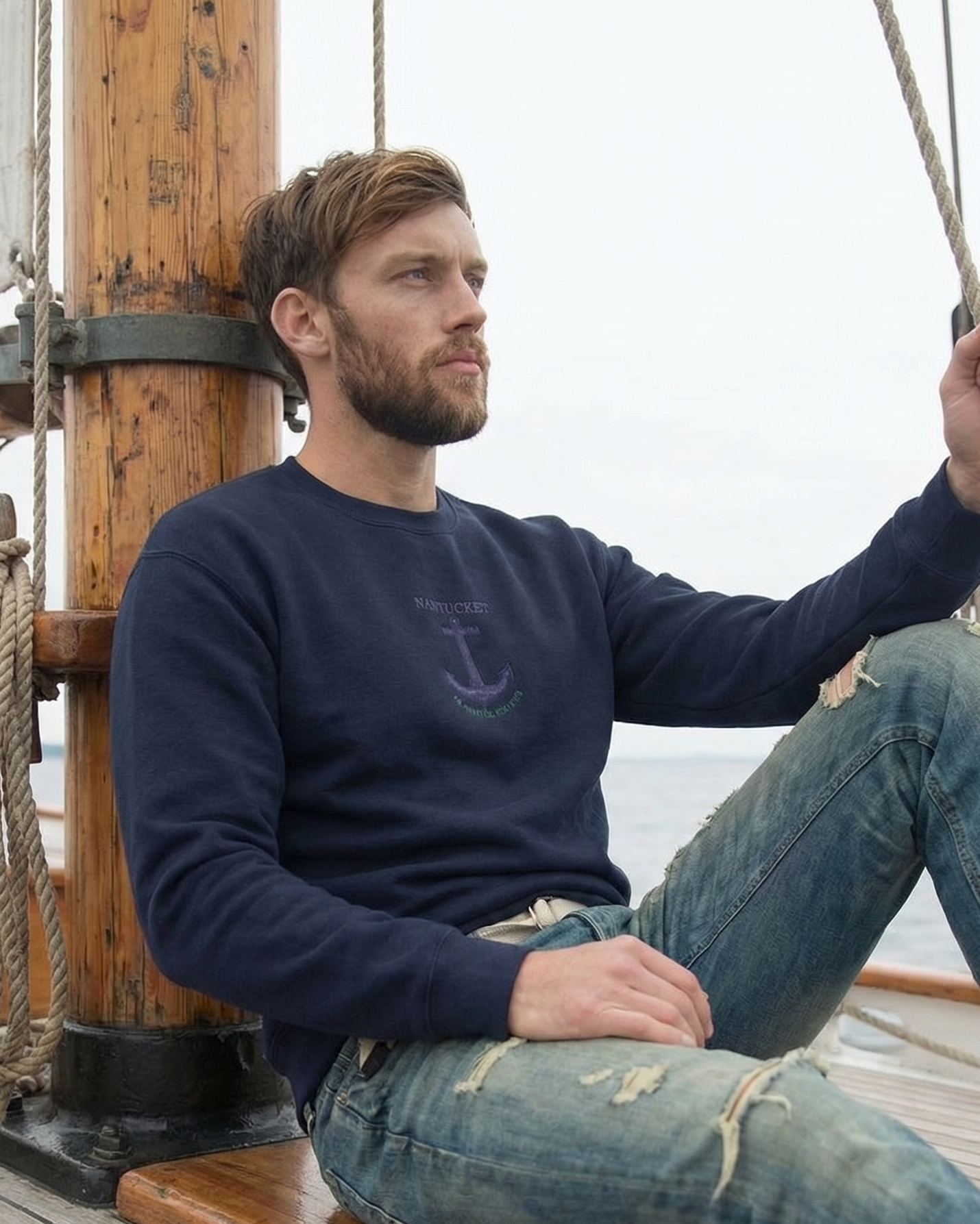 Man sitting on a wooden swing on a ship