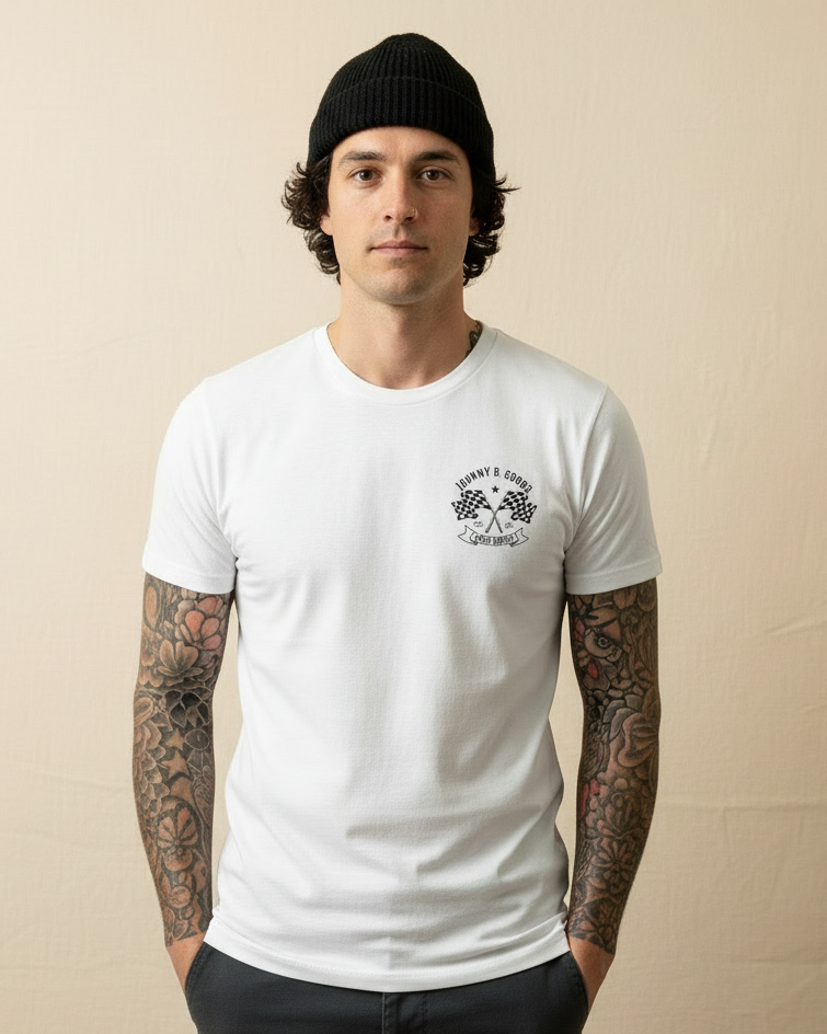 Man wearing a white t-shirt with a logo and black beanie against a beige background