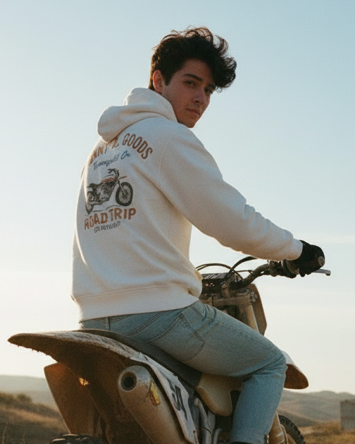 Person on a dirt bike in an open field with a scenic background