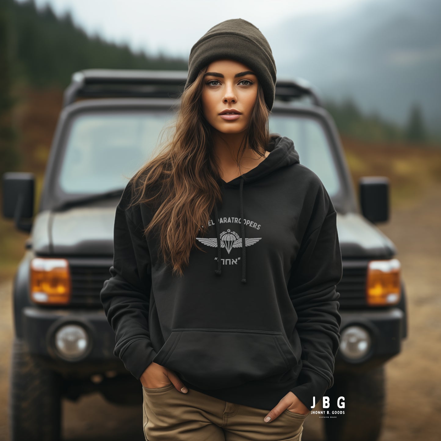 young woman wearing black idf hoodie with paratroopers logos 