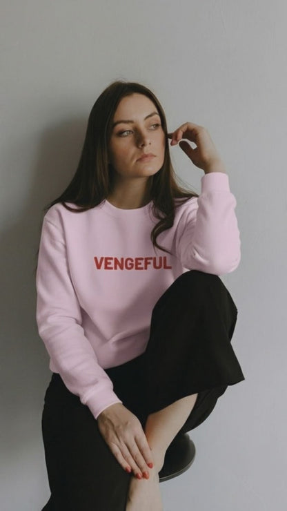 a woman wearing a ping Embroiderd vengeful sweatshirt from JBG
