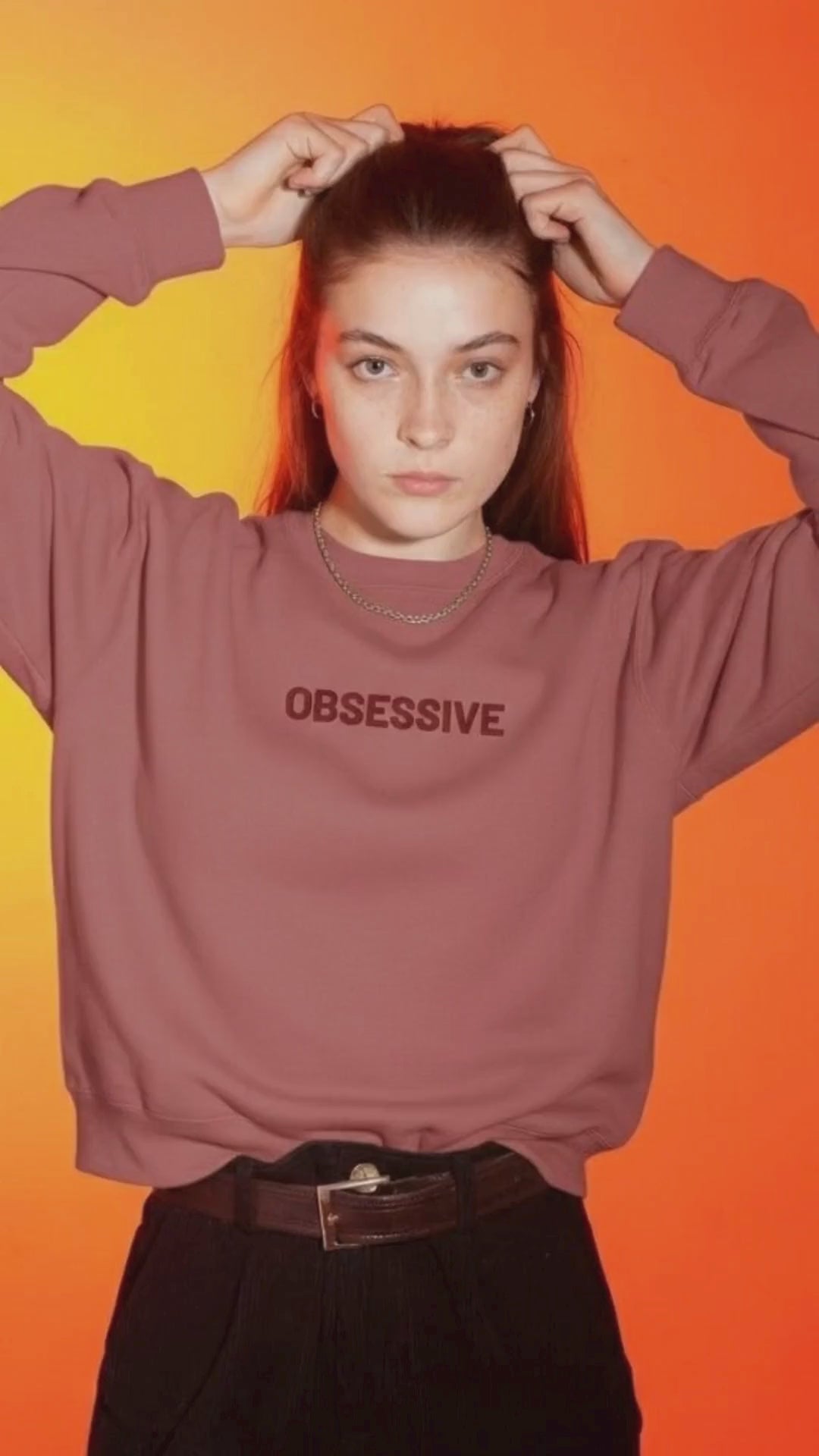 young woman wearing Obsessive JBG brand Sweatshirt