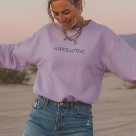 Young Woman Wearing Purple JBG hyperactive Embroidered Sweatshirt