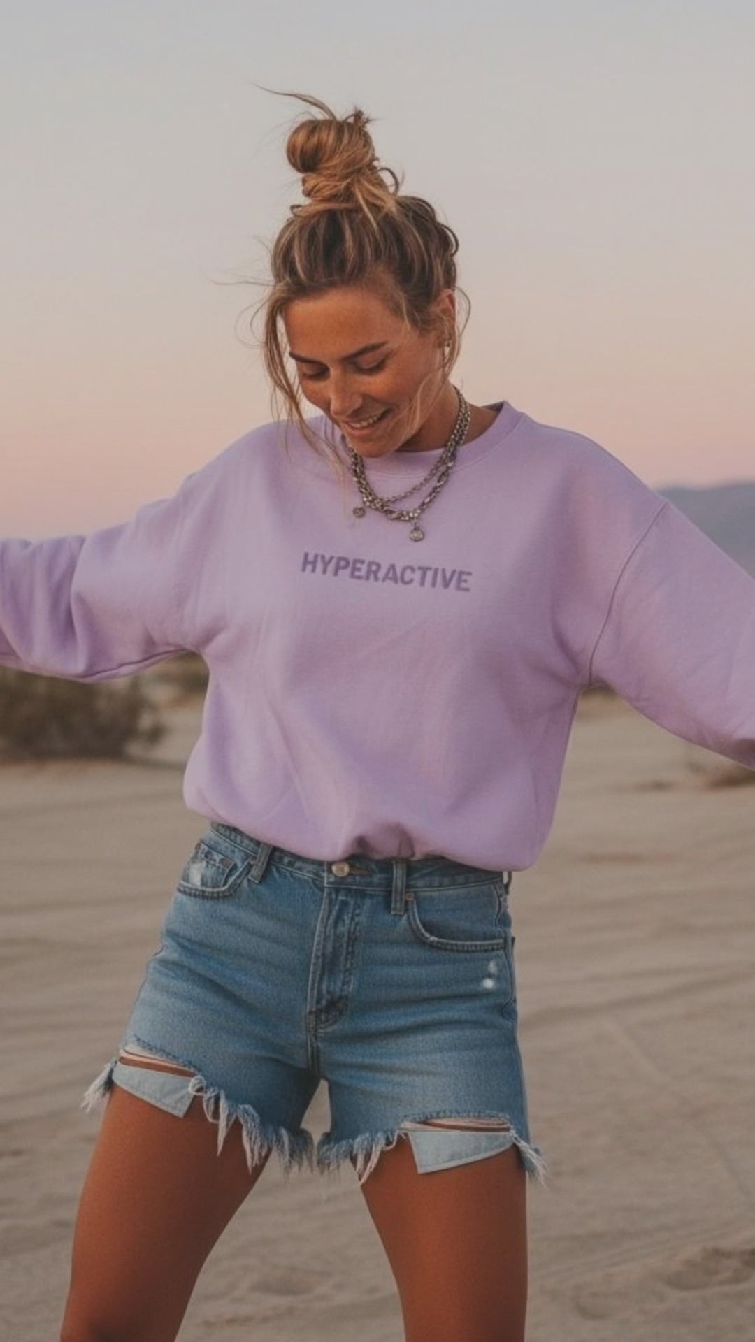 Young Woman Wearing Purple JBG hyperactive Embroidered Sweatshirt